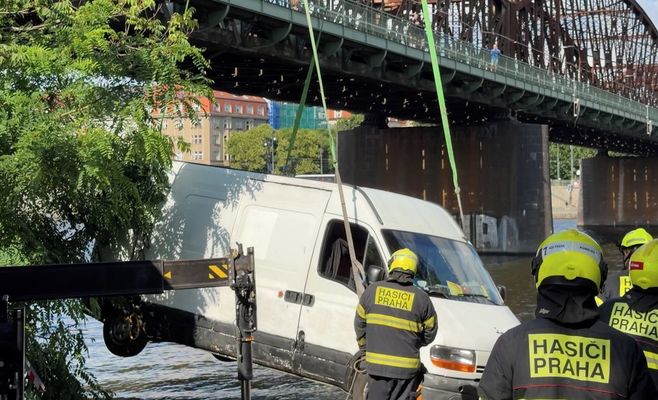 Van serving as home for homeless people rolls into Vltava River in Prague