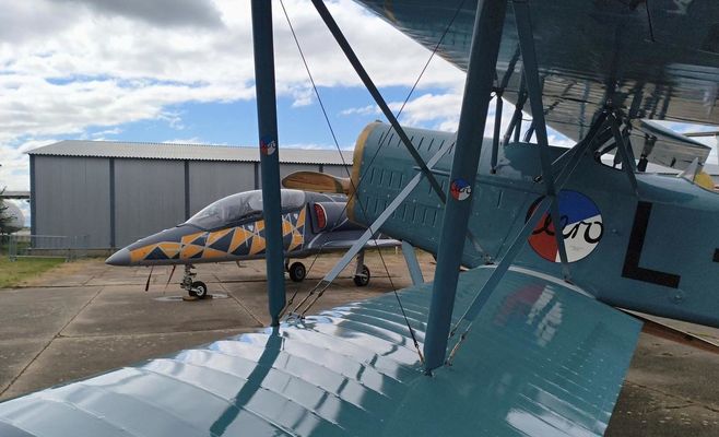 A Century Apart: Restored Ab-11 Biplane Meets Modern Skyfox Jet in Prague