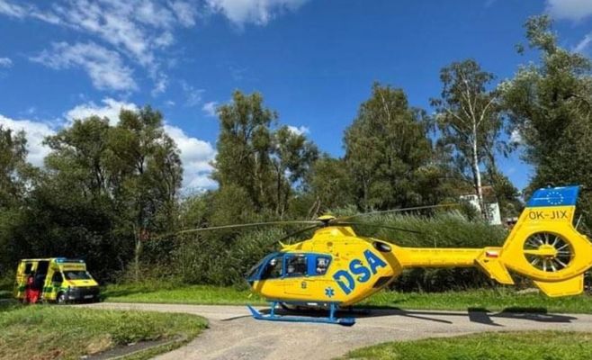Motorcyclist Collides with Car Towing a Caravan While Overtaking in South Bohemia