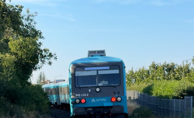 Driver Flees Scene After Car Collides With Train Near Kladno, Leaving Bumper With License Plate Behind