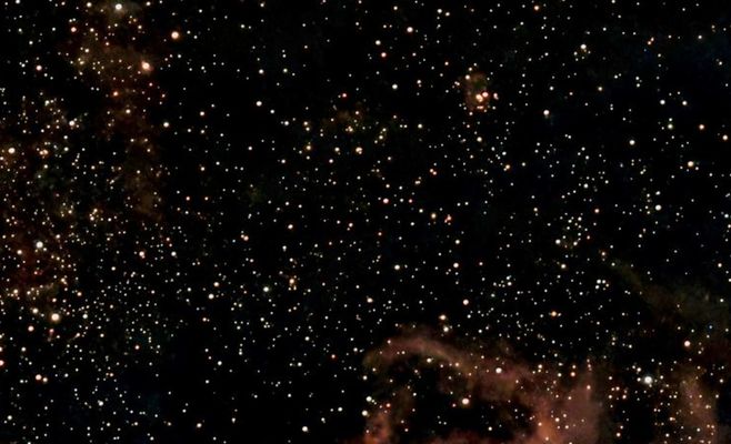 A Glowing-Eyed Cosmic Cat Emerges From Dust in New Hubble and Webb Images